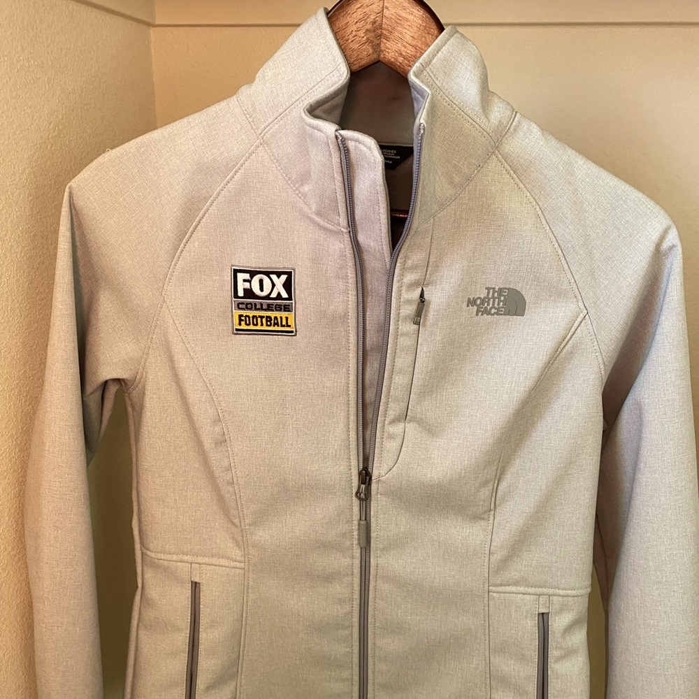 The North Face womens jacket, size small, branded by Fox College Football. NWT!!